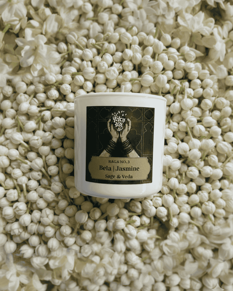 Sage and Veda Heritage Candle burning in a calm home setting