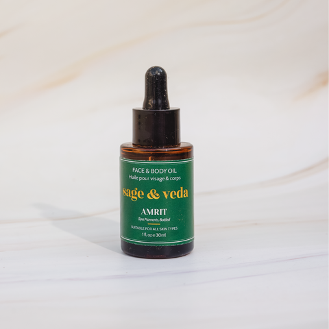 Sage & Veda Amrit face body oil 100ml bottle against neutral marble background.