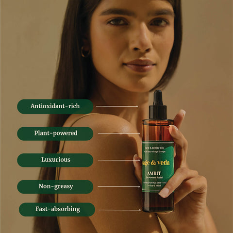 Woman holding Sage & Veda Amrit Face & Body Oil bottle, highlighting antioxidant-rich, plant-powered, non-greasy formula.