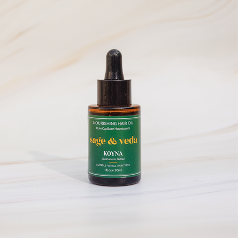 Sage & Veda Koyna hair oil oil 100ml bottle against neutral marble background.