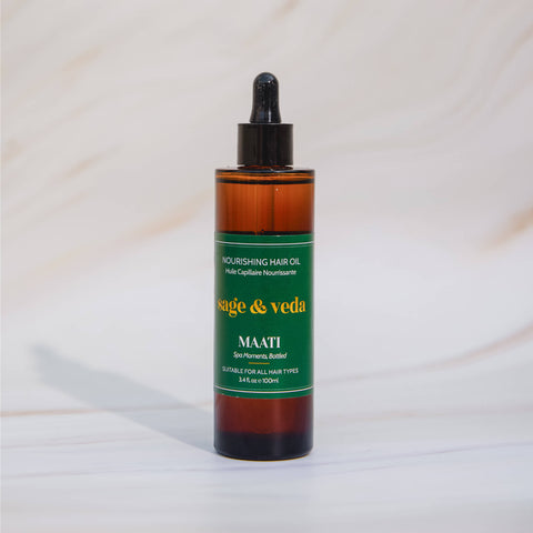 Sage & Veda Maati face Body oil 100ml bottle against neutral marble background.